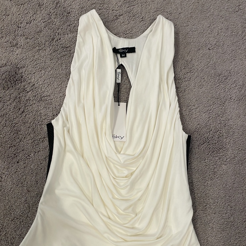 New with tags Sky shirt with faux leather on one side and white sexy front